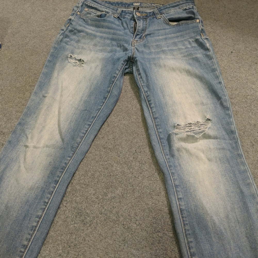 Used jeans slightly torn.